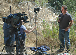 Mike Tobin of Fox News broadcasting near Kiryat Shemona