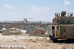 IDF armored personnel carrier facing Egyptian outpost at Kerem Shalom crossing